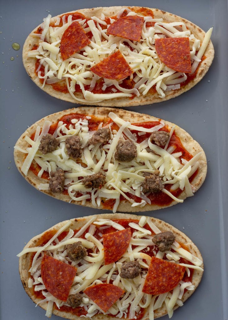 This Air Fryer Pizza requires just 7 minutes of cooking time! You can make your favorite pizza with a crispy, crunchy crust right in your air fryer! This is the perfect weeknight pizza recipe. 