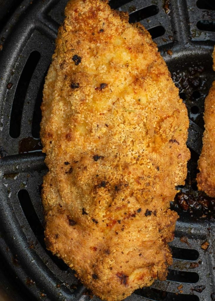 These Air Fryer Chicken Tenders get perfectly crispy with a parmesan cheese crust! Keto, low-carb, gluten free and easy to meal prep for an easy weeknight meal.