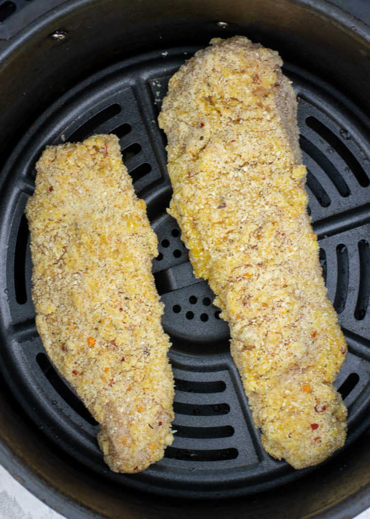 These Air Fryer Chicken Tenders get perfectly crispy with a parmesan cheese crust! Keto, low-carb, gluten free and easy to meal prep for an easy weeknight meal.