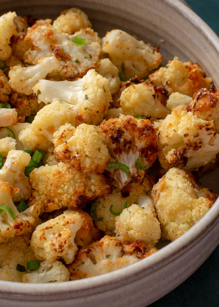 This is the Best Air Fryer Cauliflower recipe! This cauliflower is loaded with flavor and super crispy on the outside while being perfectly tender on the inside! This easy air fryer vegetable recipe is ready in less than 15 minutes!