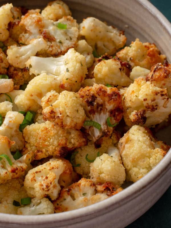 This is the Best Air Fryer Cauliflower recipe! This cauliflower is loaded with flavor and super crispy on the outside while being perfectly tender on the inside! This easy air fryer vegetable recipe is ready in less than 15 minutes!