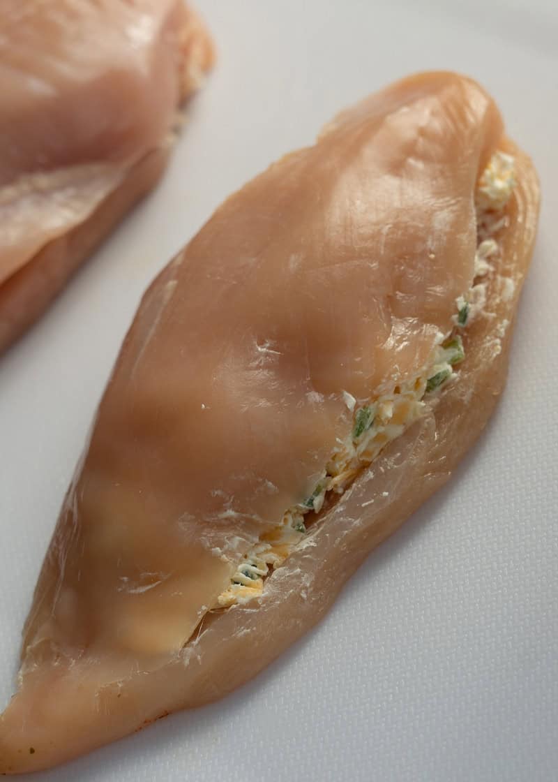 raw chicken breast stuffed with creamy, cheesy jalapeno mixture