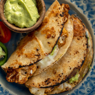 These crispy Cauliflower Tacos are so simple to make and require just a few basic ingredients! Vegetarian tacos with Avocado Crema is the perfect healthy meal!