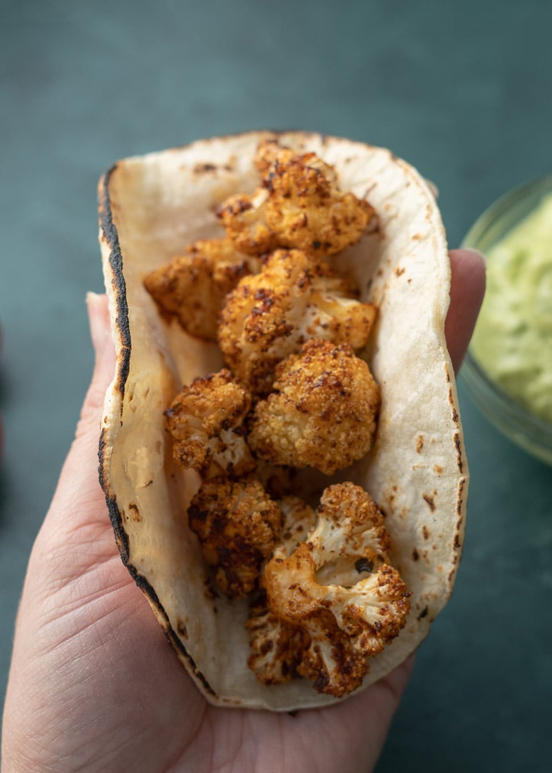 These crispy Cauliflower Tacos are so simple to make and require just a few basic ingredients! Vegetarian tacos with Avocado Crema is the perfect healthy meal! 