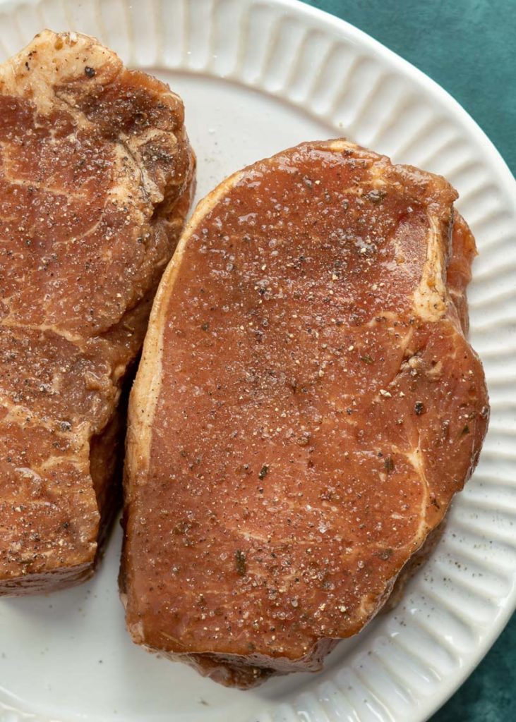 These Air Fryer Pork Chops is a 20 minute recipe perfect for weekday nights! Cooking pork chops in the air fryer gives you juicy, tender, perfect pork chops.