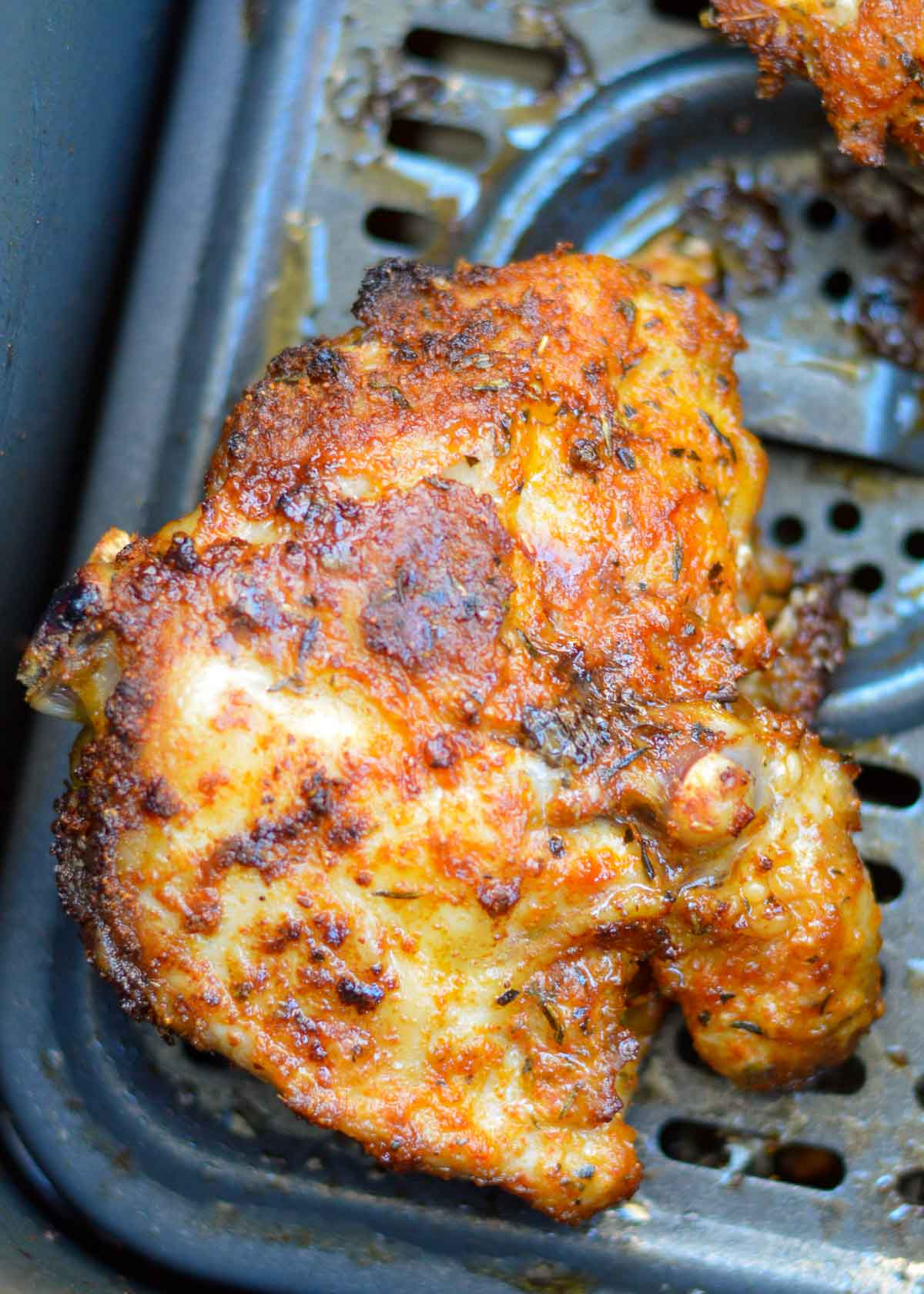 These amazing Air Fryer Cajun Chicken Thighs are super juicy, tender, and ready in just 20 minutes! Easy, inexpensive, gluten-free, keto, and perfect for a busy weeknight.