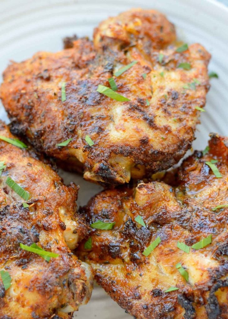 These amazing Air Fryer Cajun Chicken Thighs are super juicy, tender, and ready in just 20 minutes! Easy, inexpensive, gluten-free, keto, and perfect for a busy weeknight.