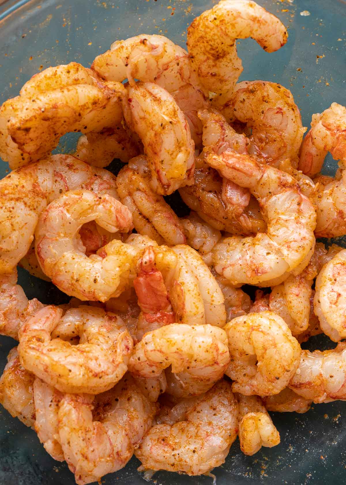 seasoned shrimp in mixing bowl