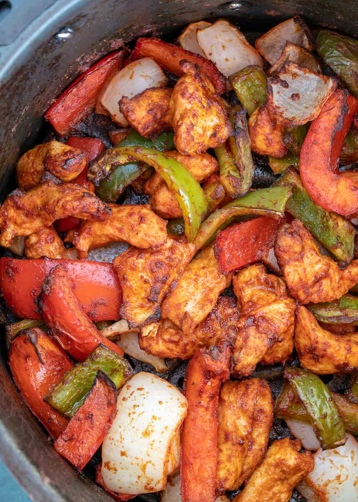 These Air Fryer Chicken Fajitas are ready in just 10 minutes! These flavorful fajitas feature juicy chicken and perfectly cooked peppers and onions!