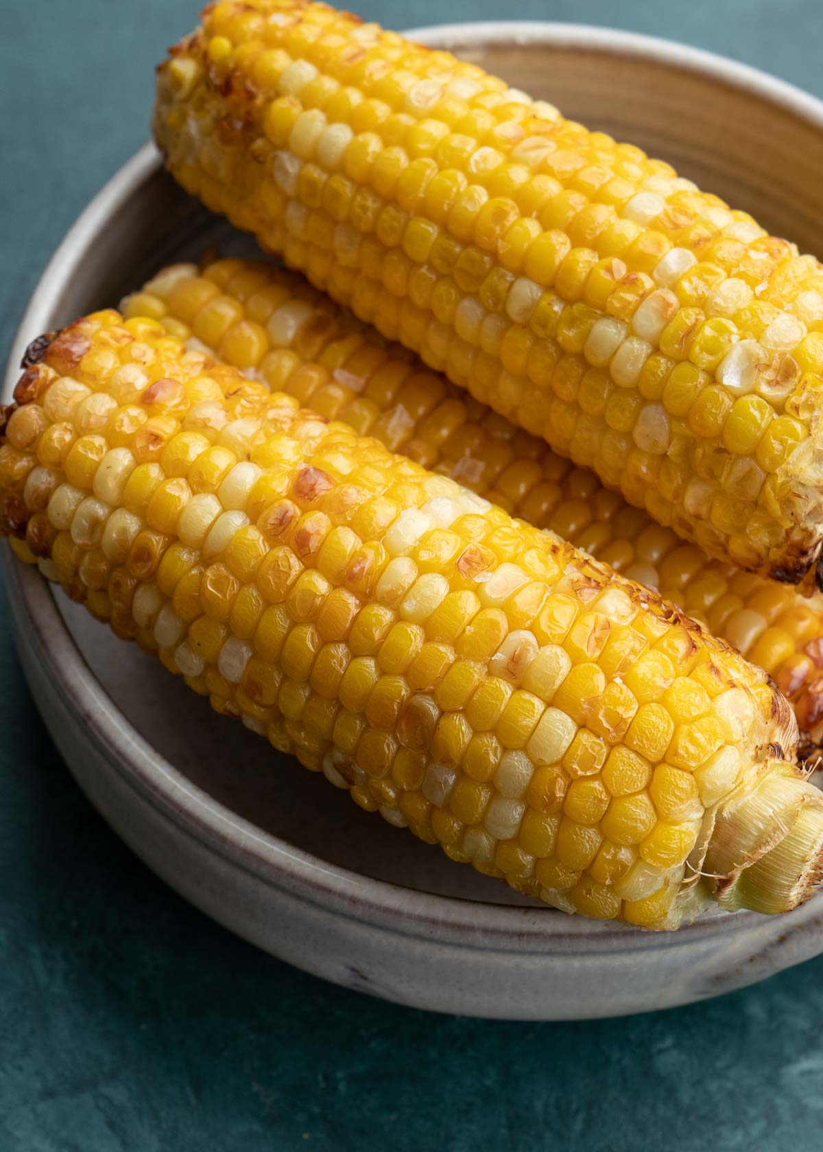 This Air Fryer Corn on the Cob is the best way to cook corn! Ready in just 10 minutes, this corn turns out perfect every single time!