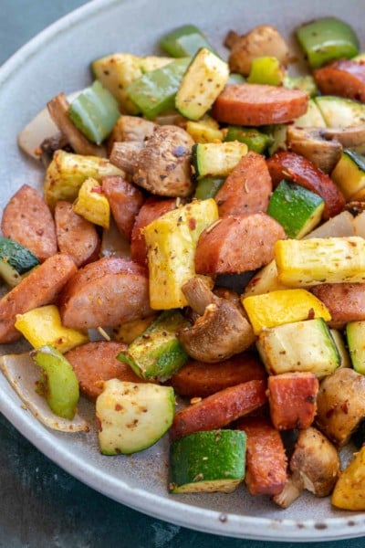 smoked sausage and vegetables on white plate