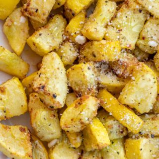 Air fried yellow squash with parmesan on a plate