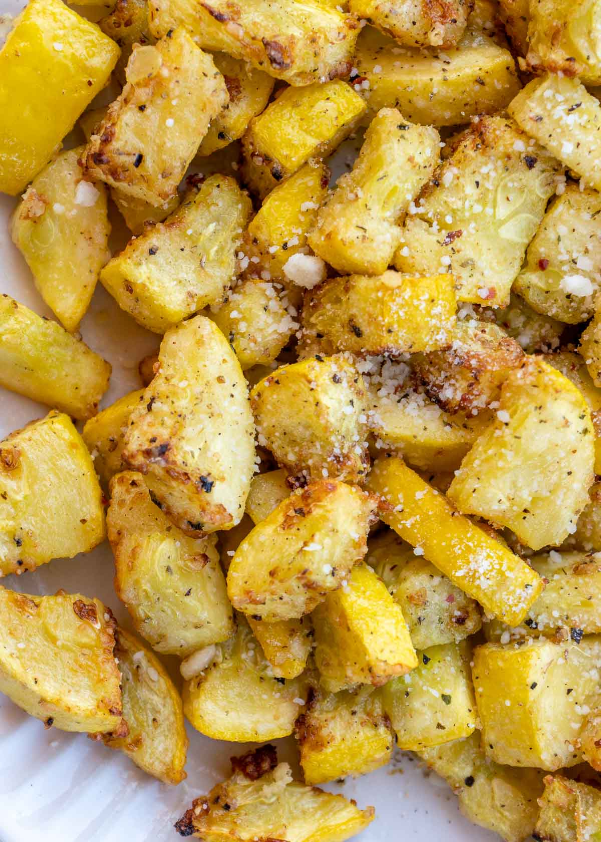 Air fried yellow squash with parmesan on a plate