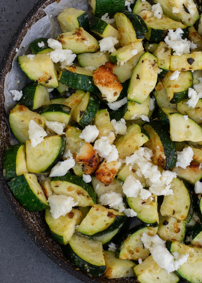 zucchini with feta on white plate
