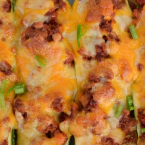 close up of chili cheese stuffed zucchini boats