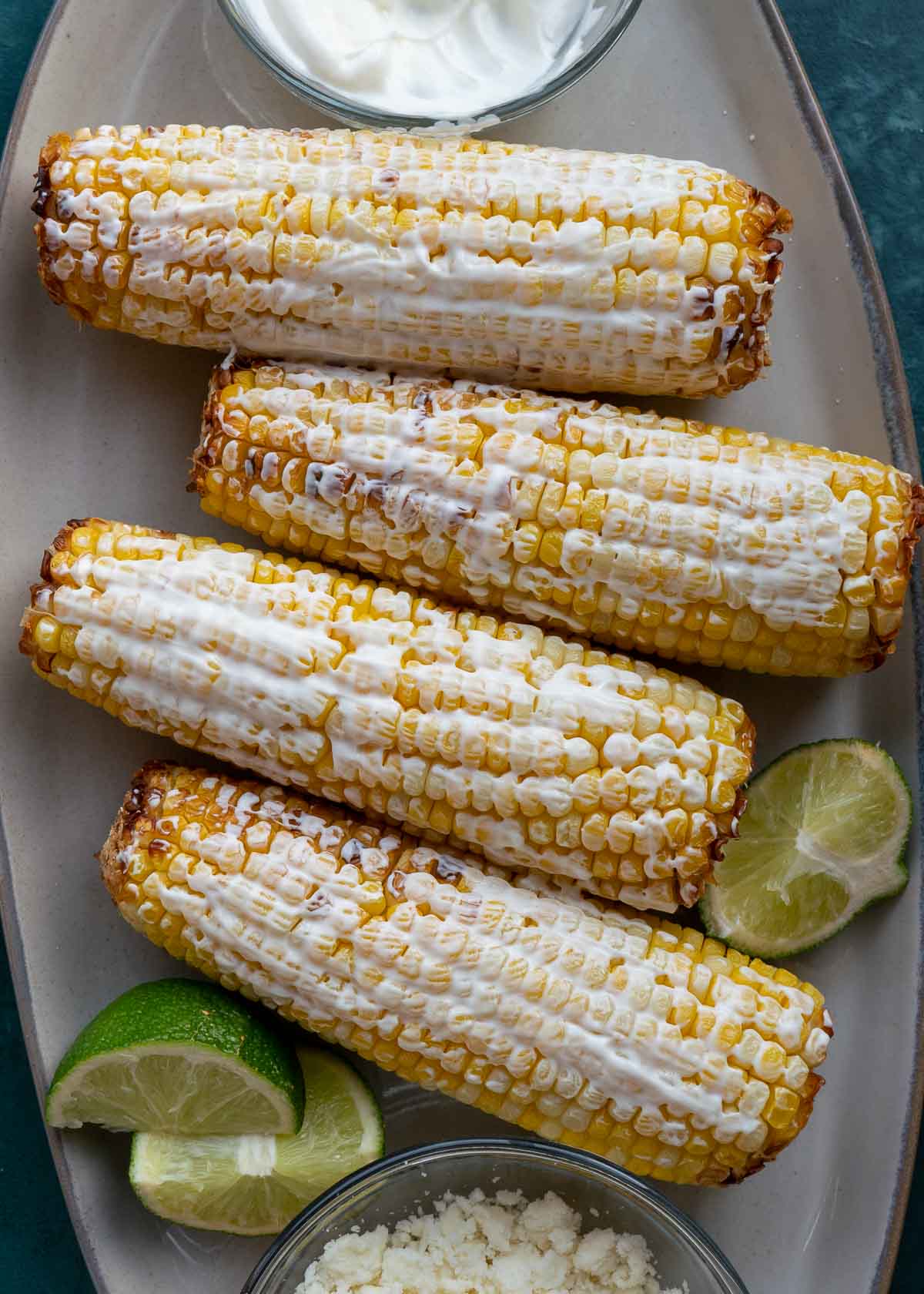 corn on plate with sour cream