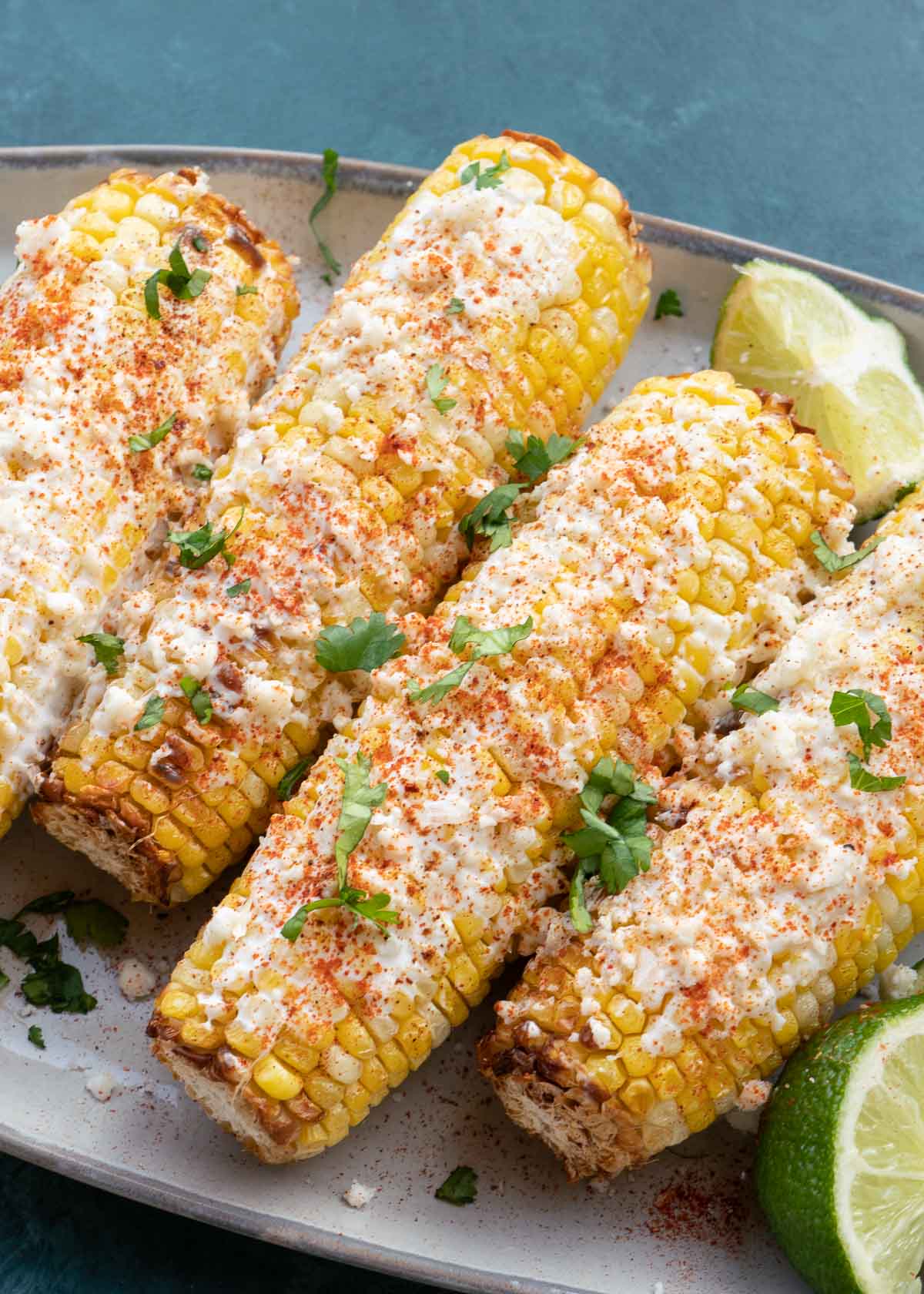 Mexican Street Corn is the ultimate side dish, it is sweet, salty and savory! Now you can make this easy corn recipe in the air fryer in just 10 minutes!