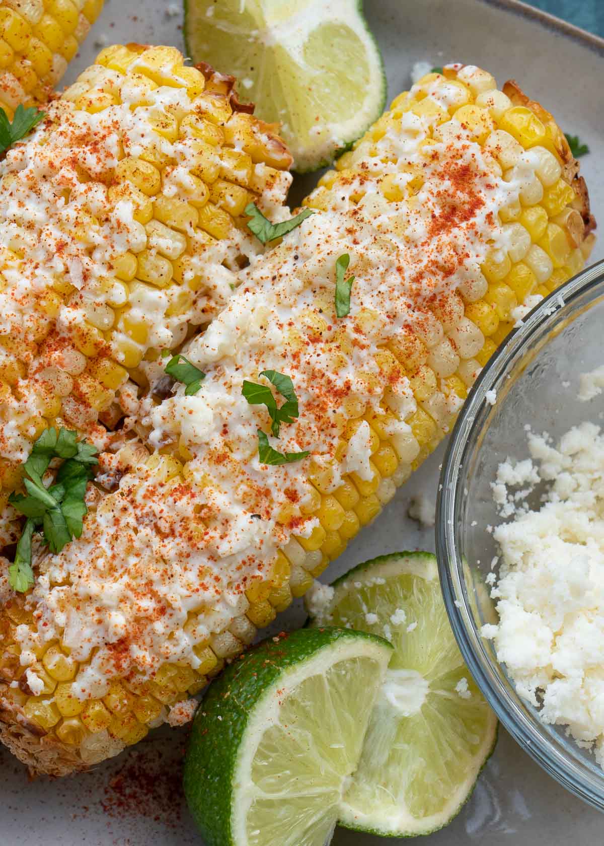 Mexican Street Corn is the ultimate side dish, it is sweet, salty and savory! Now you can make this easy corn recipe in the air fryer in just 10 minutes! 