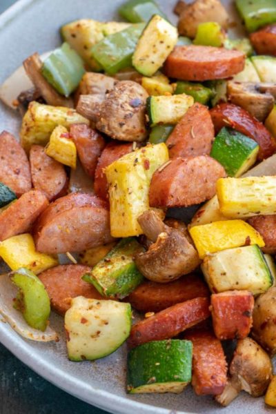 smoked sausage and vegetables on white plate