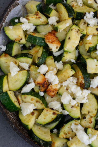 zucchini with feta on white plate