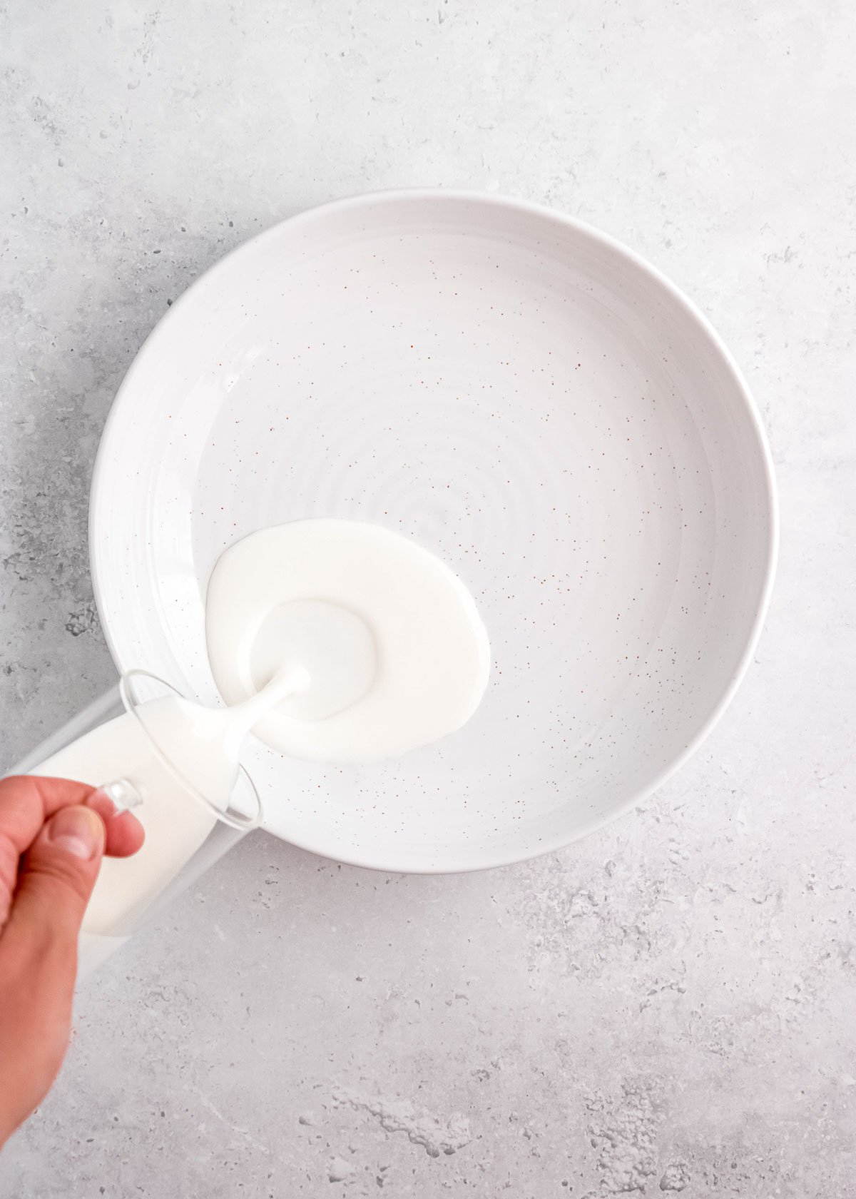 pouring buttermilk in bowl