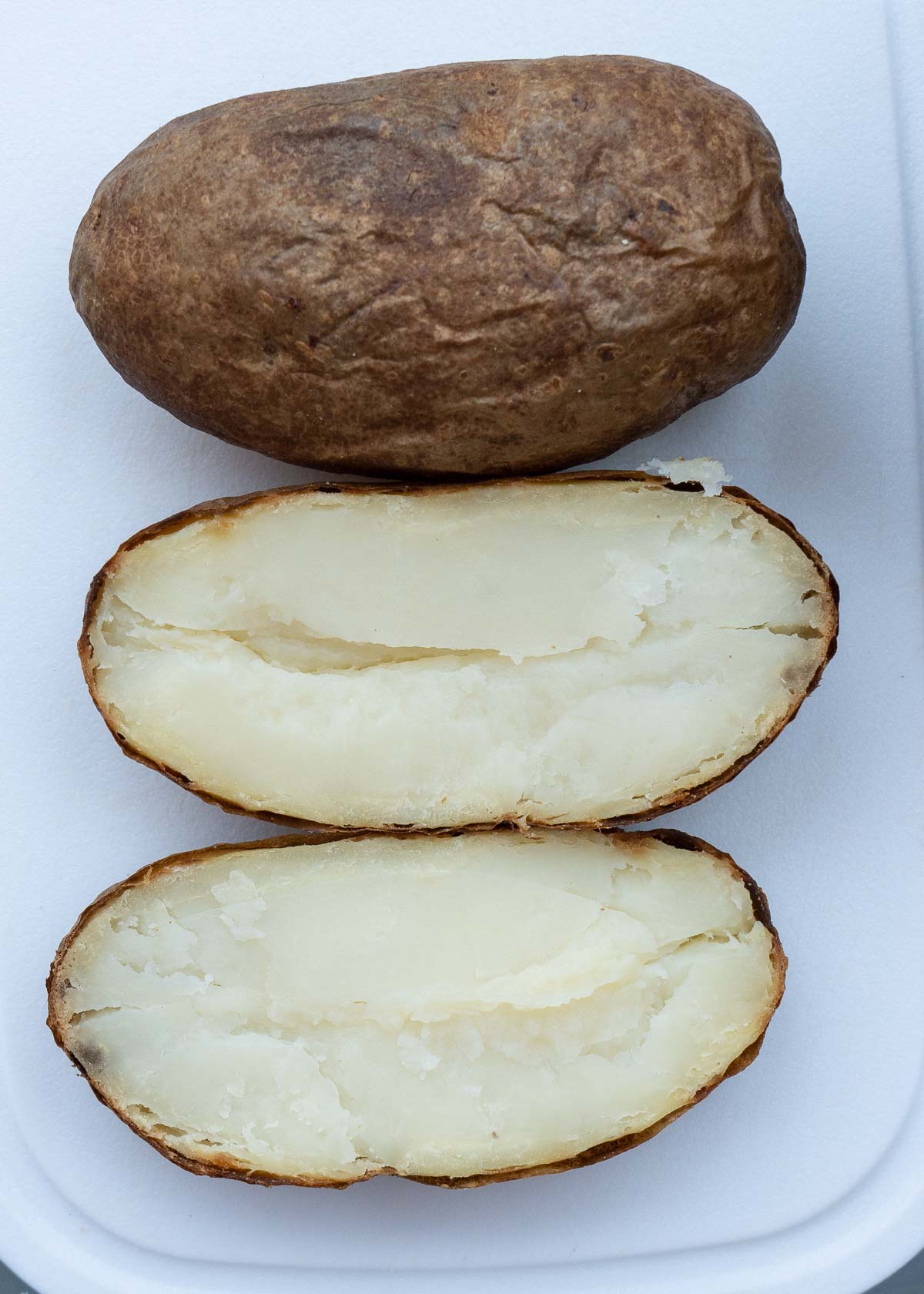 slice in half lengthwise for two separate potato halves.