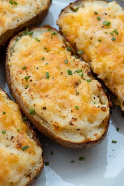 top twice baked potatoes with fresh herbs for a boost of flavor and presentation