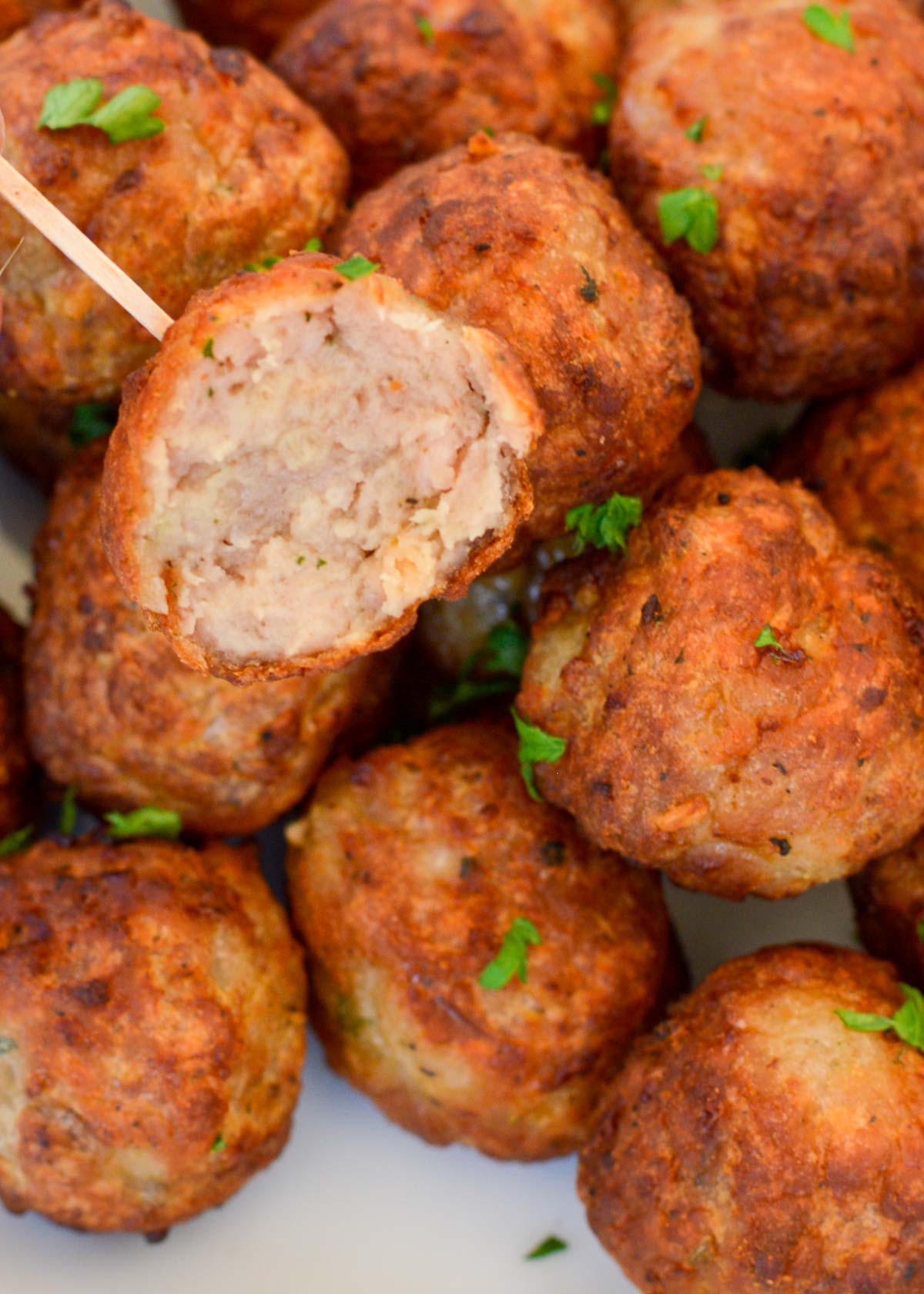 Learn how to cook frozen meatballs in the air fryer for an easy appetizer or meal! The 2-ingredient sauce is simple and delicious.