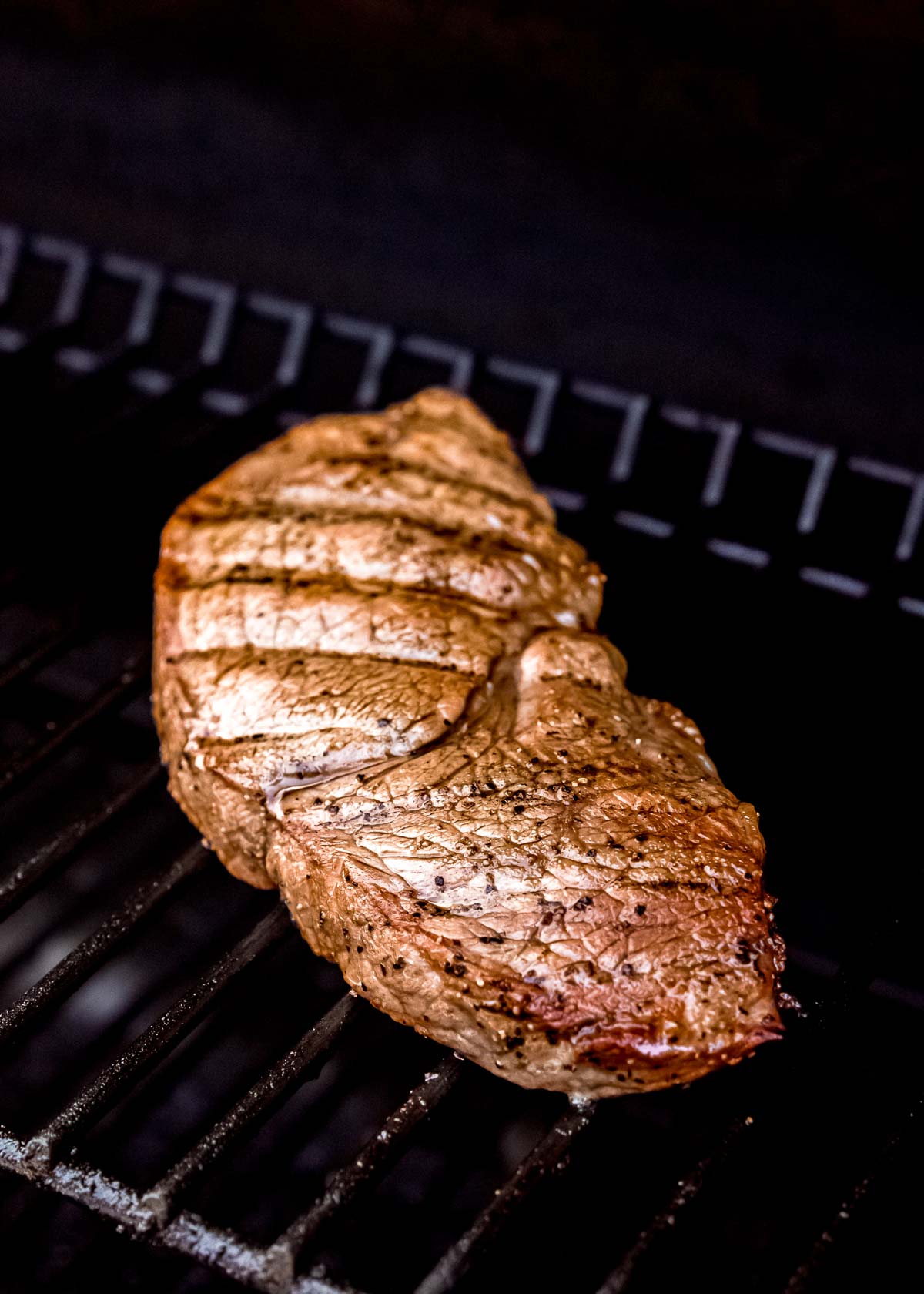 steak being grilled on grill 