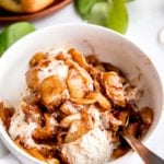 air fryer apples over a bowl of ice cream