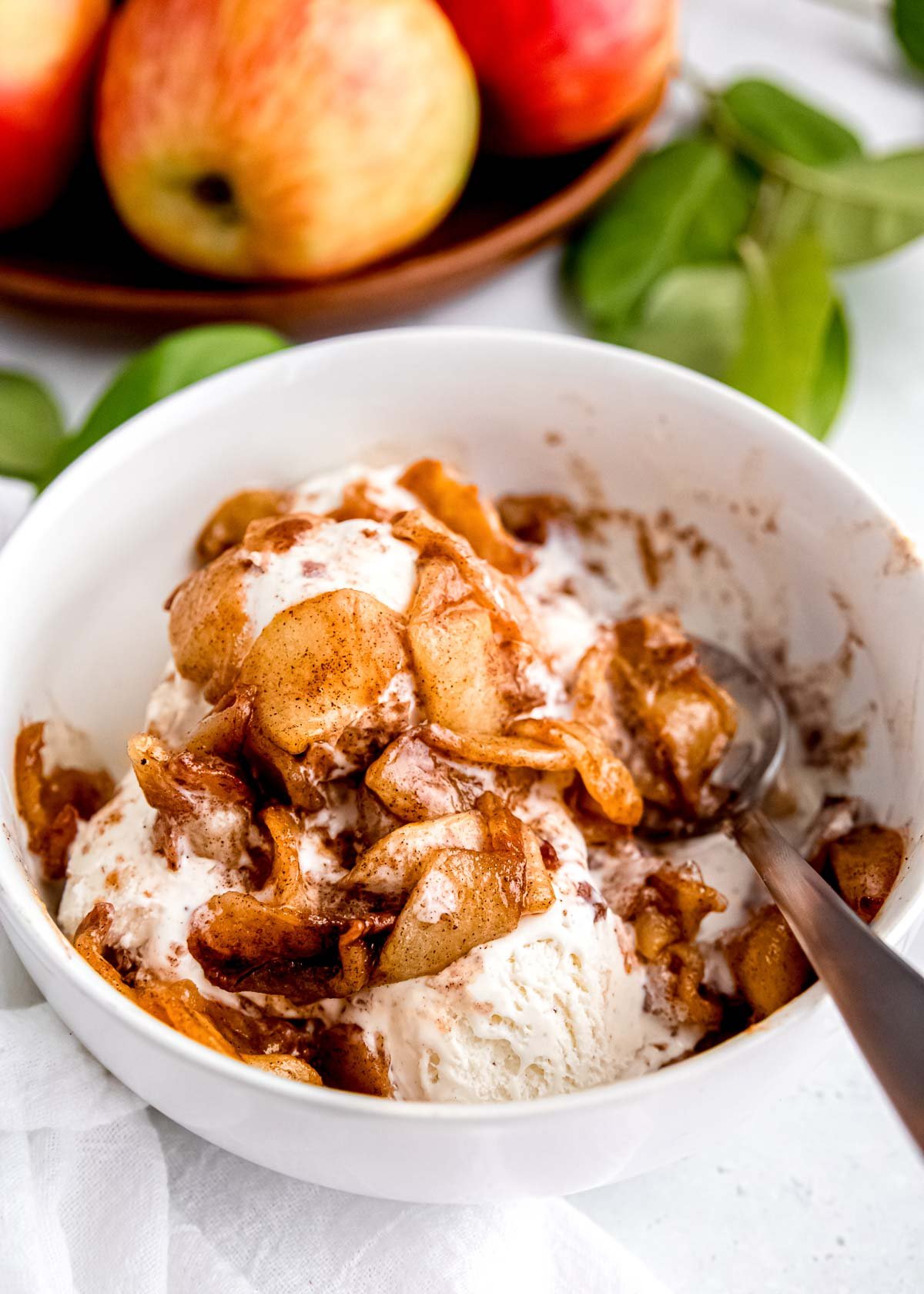 air fryer apples on ice cream in a bowl
