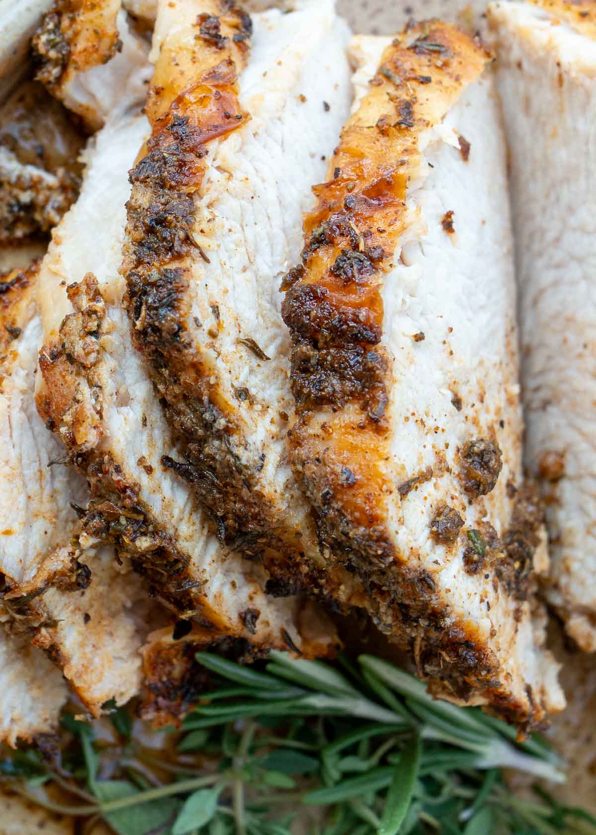 a perfectly seasoned turkey breast cut into slices