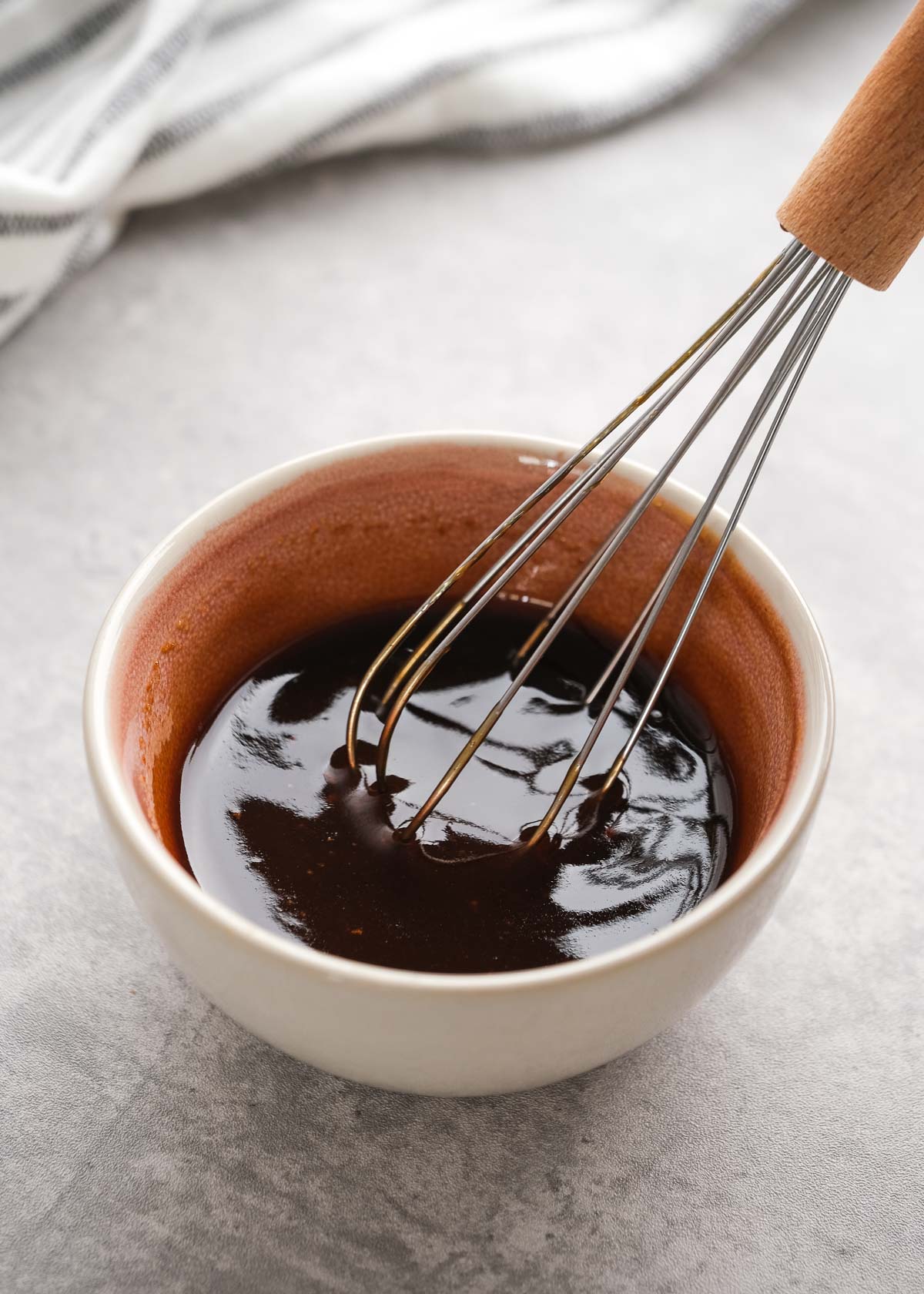 whisking bbq sauce together