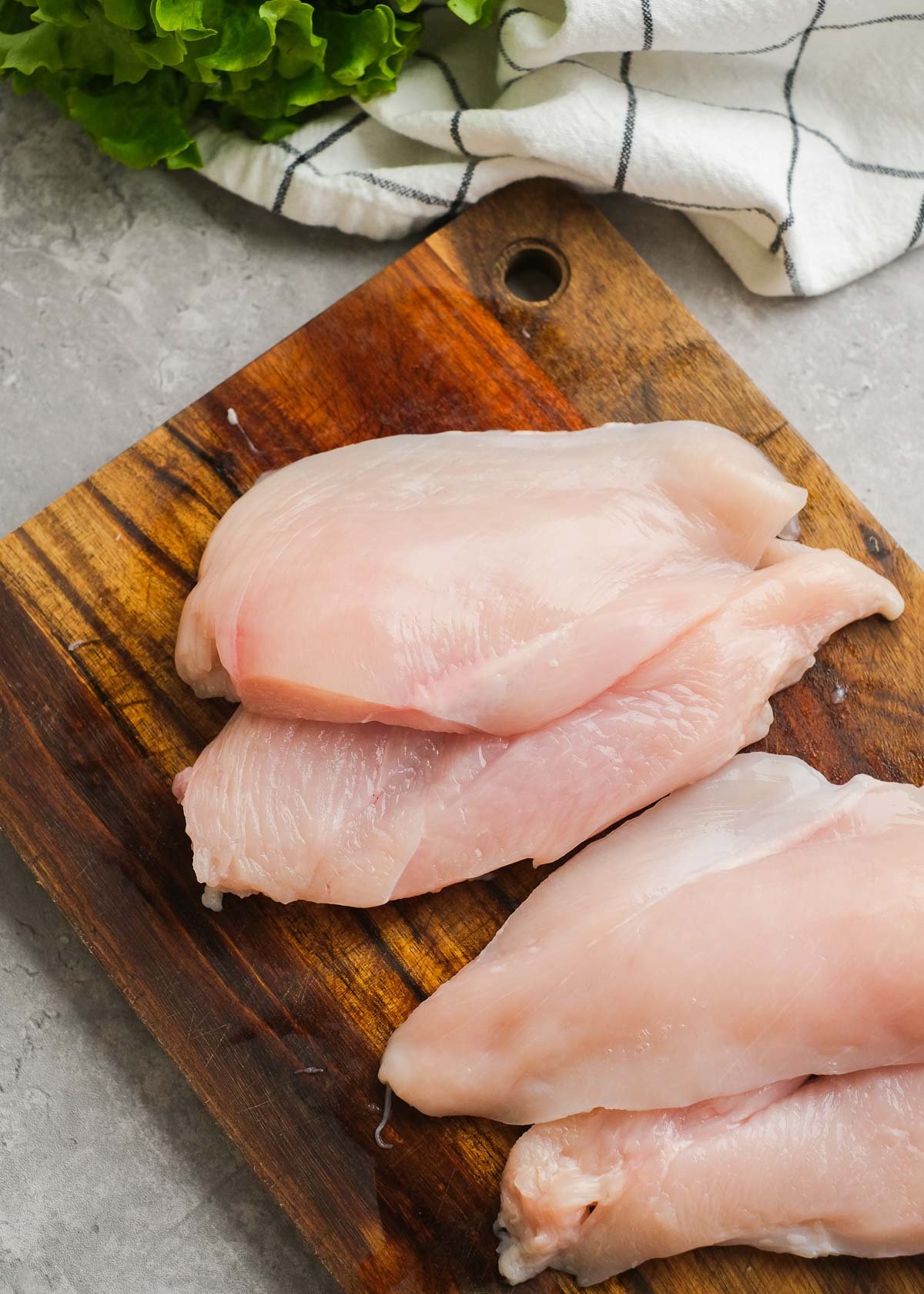 two chicken breasts cut into four thin chicken breast fillets