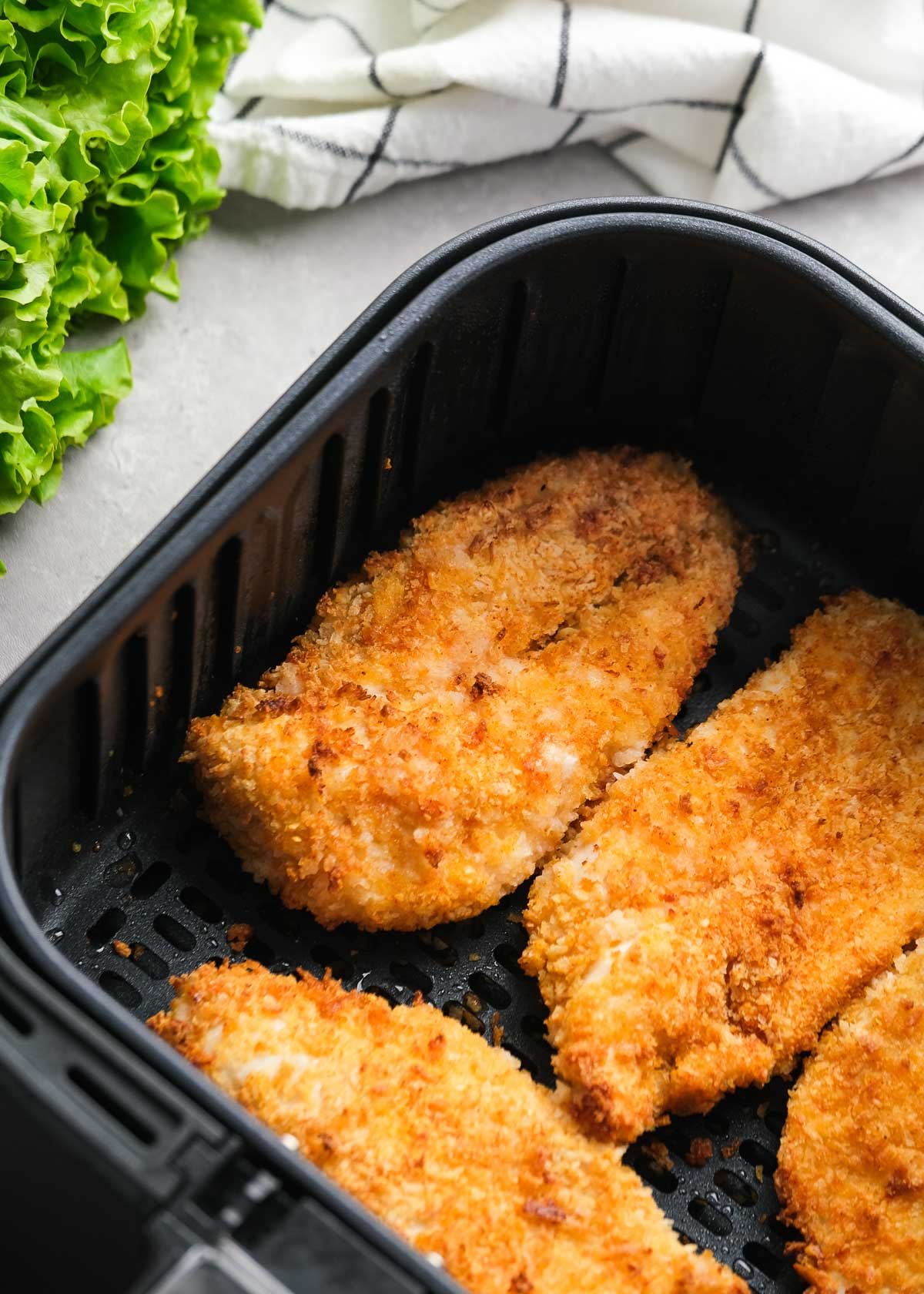 cooked, juicy breaded chicken in an air fryer