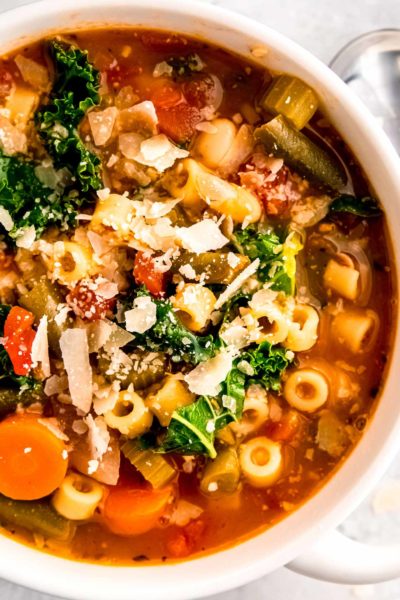 a hearty bowl of minestrone soup garnished with parmesan