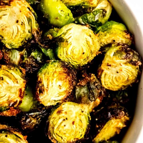 a bowl of halves, crispy Air Fryer Brussels Sprouts