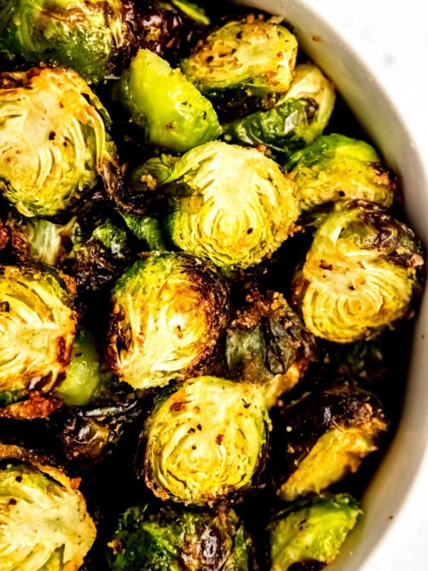 a bowl of halves, crispy Air Fryer Brussels Sprouts