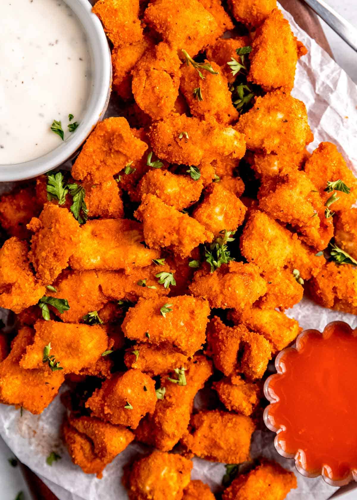 buffalo chicken and dipping sauce on white table