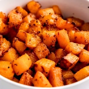 cubed air fryer butternut squash in white bowl