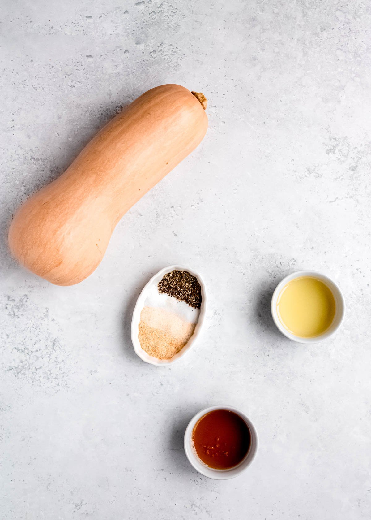 air fryer butternut squash ingredients on a white table