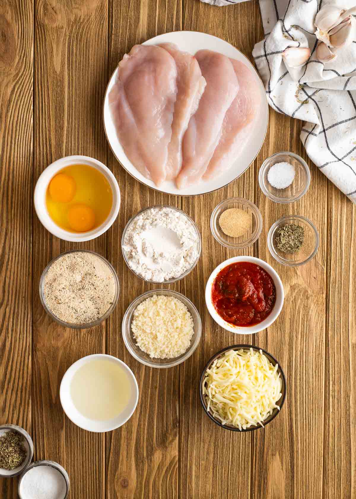 an overhead shot of the ingredients needed for chicken parmesan