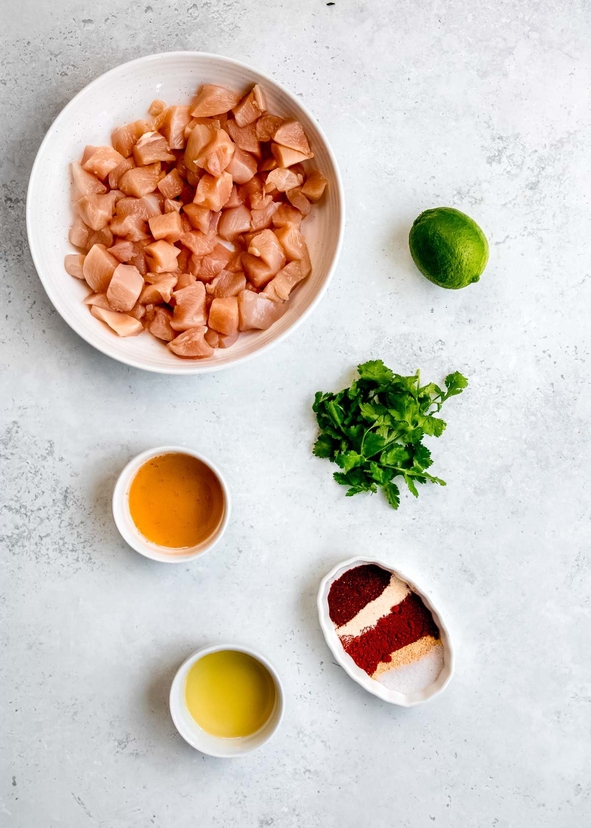 cilantro lime chicken bite ingredients on a white table