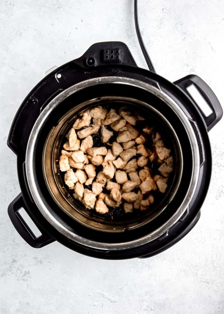 overhead shot of cooked chicken bites in the air fryer