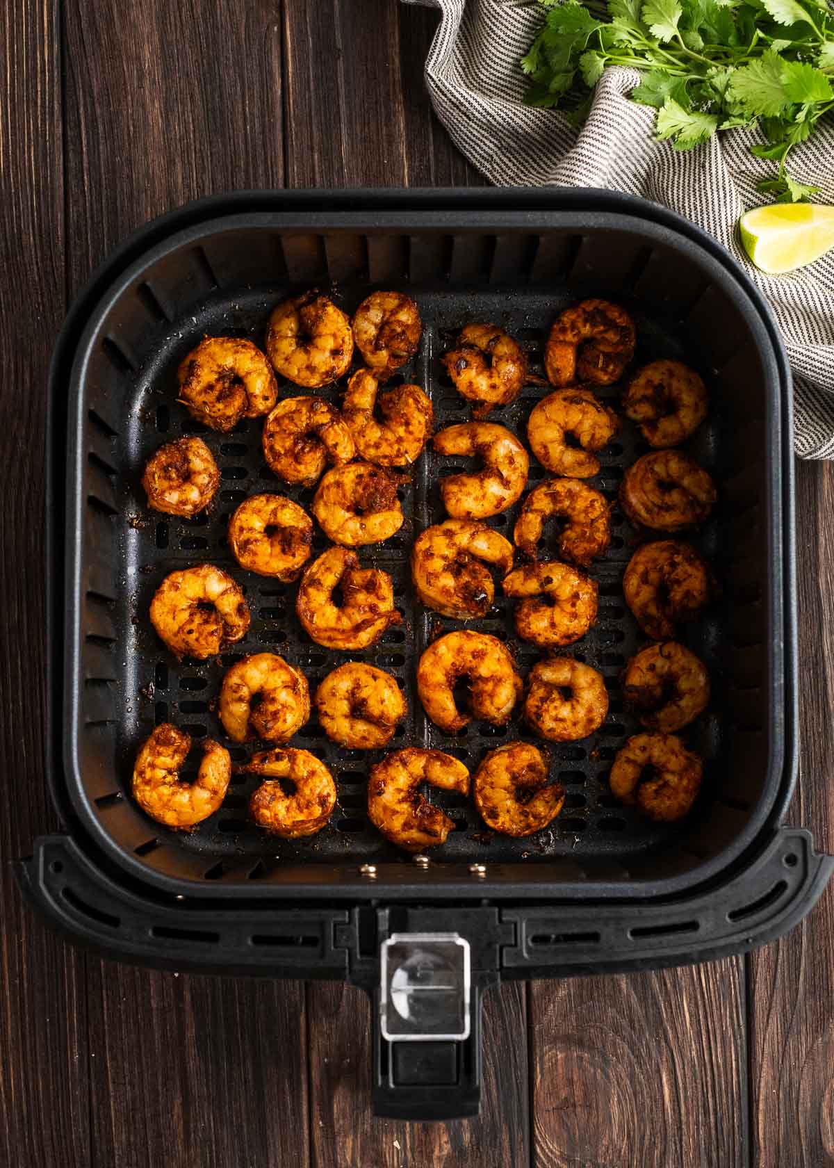 overhead image of cooked shrimp in air fryer