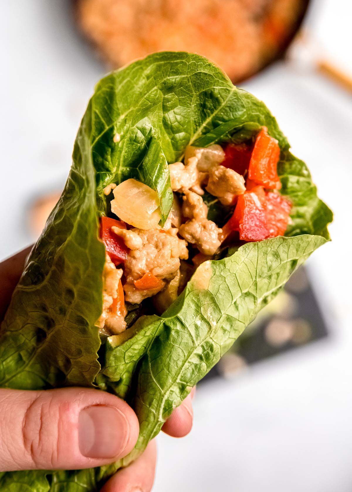 thai chicken mixture wrapped in a romaine lettuce leaf
