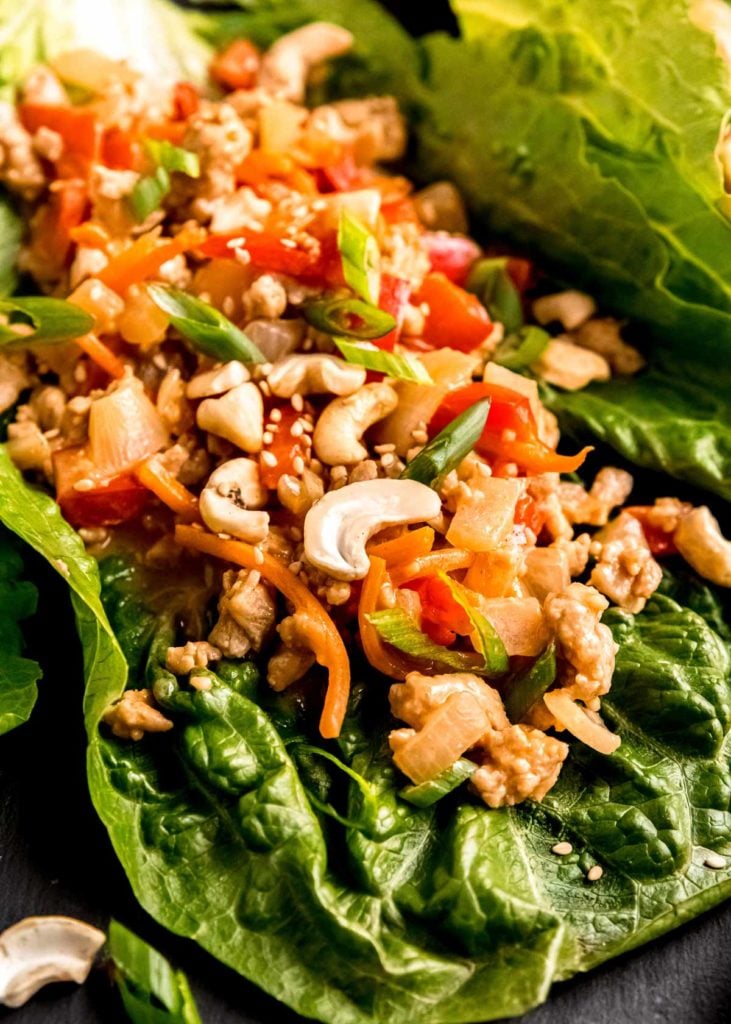 delicious thai chicken and veggies in a lettuce leaf
