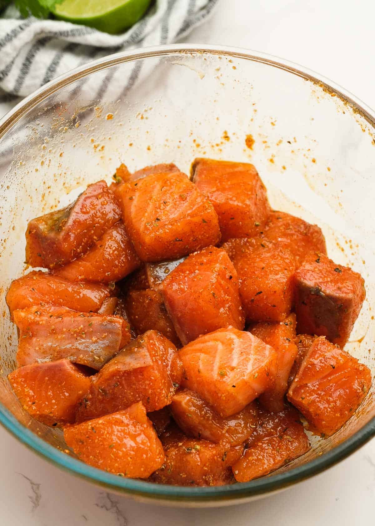 seasoned salmon bites in a glass bowl