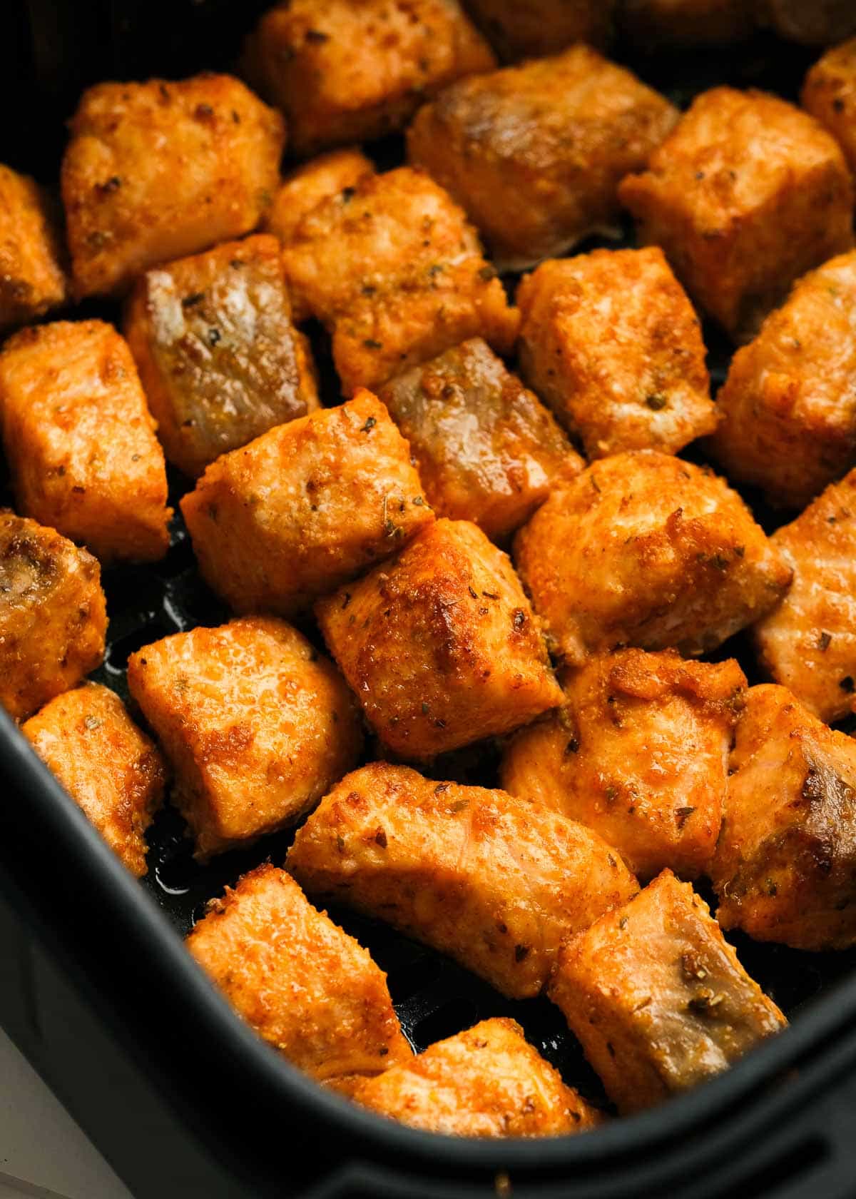 closeup view of salmon bites in the air fryer