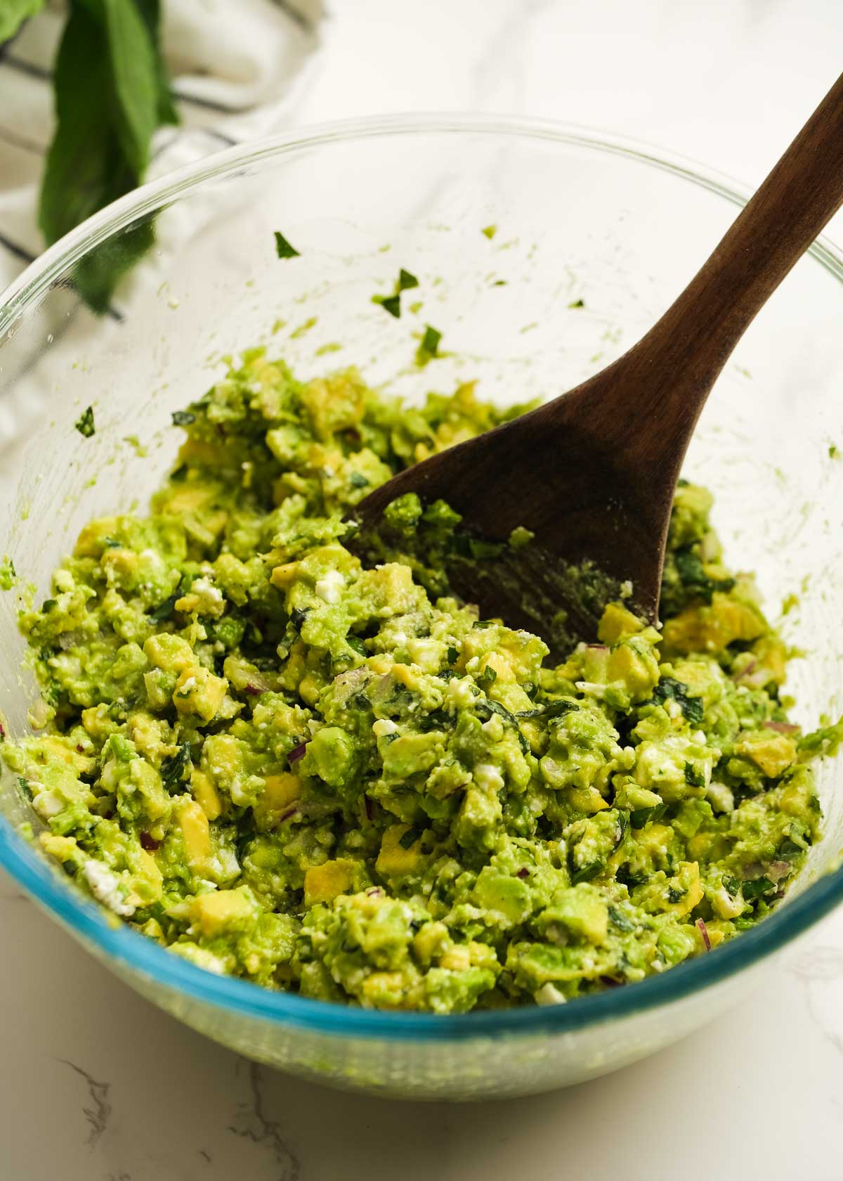 avocado dip in a bowl with a spoon